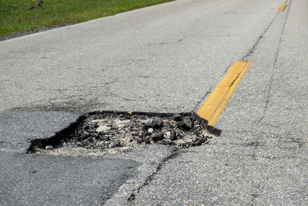 Everything You Need to Know About Potholes and How Sealcoating Helps in Prevention