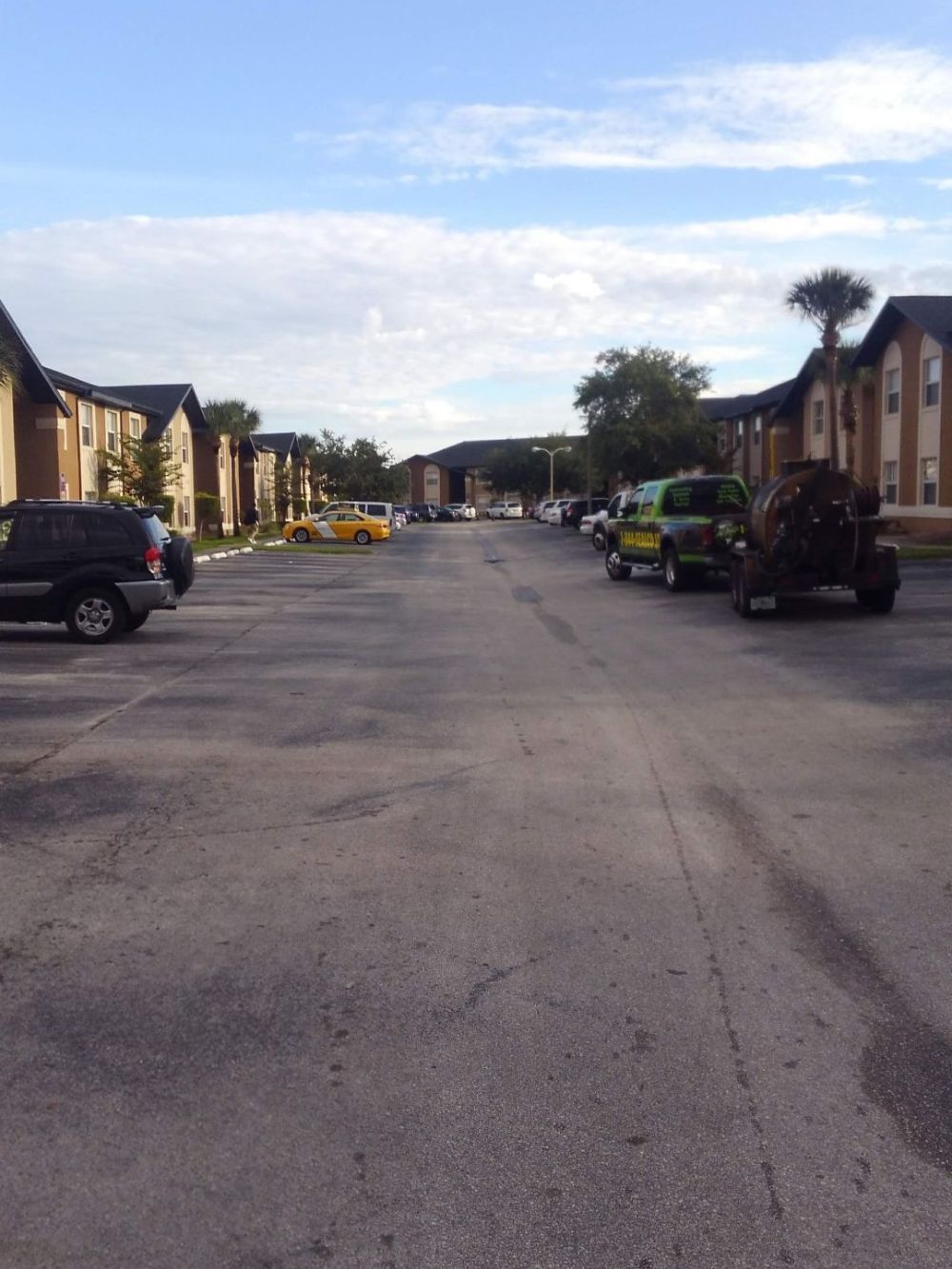 Old residential asphalt pavement with faded lines